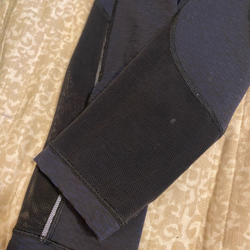 Lululemon size two capri leggings. Navy blue with mesh around bottom. - Picture 4 of 4